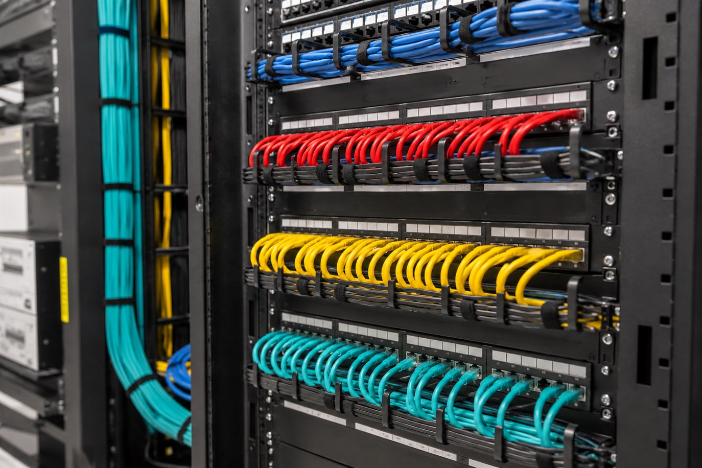 Neatly organized network patch panels and structured cabling installed by Computer Input
